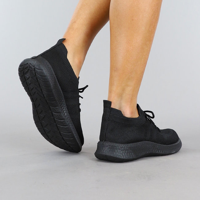 Schwarze Slip On Sneakers mit Sockenmodell