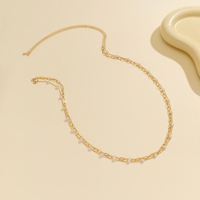 Hüftkette aus Gold mit Gliedern und Perlen