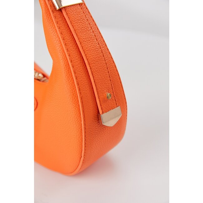 Runde orangefarbene Tasche in Lederoptik