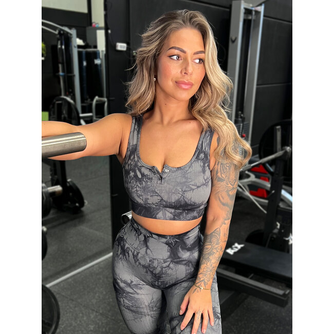 Schwarzes Sporttop in Marmoroptik mit Pushern