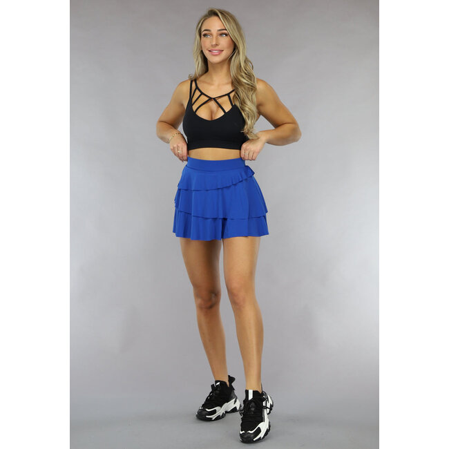 Blauer Lagen-Sportrock mit eingesetzter Hose