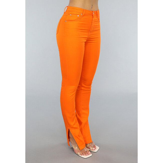 Orangefarbene Skinny Jeans mit Schlitz