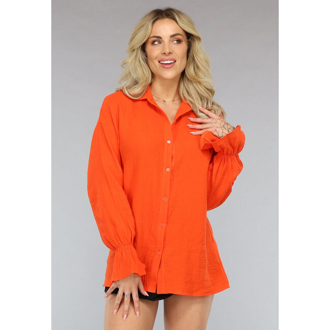 Orangefarbene Musselinbluse mit Trompetenärmeln