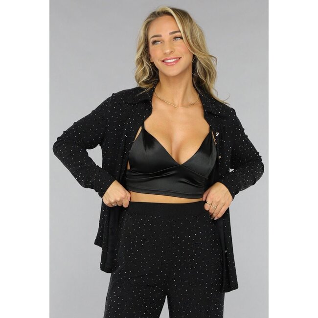 Schwarze langärmelige Glitzerbluse
