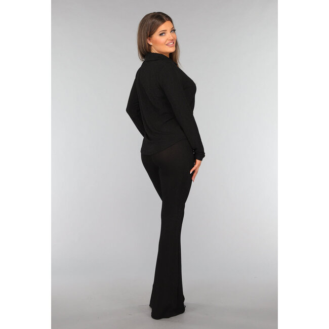 Schwarze Glitzerbluse mit goldenen Knöpfen