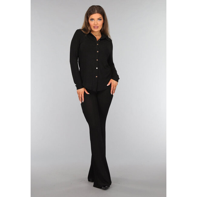 Schwarze Glitzerbluse mit goldenen Knöpfen