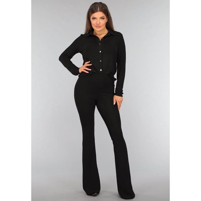 Schwarze Glitzerbluse mit goldenen Knöpfen