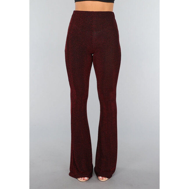 Elastische, lange Schlaghose mit rotem Glitzer