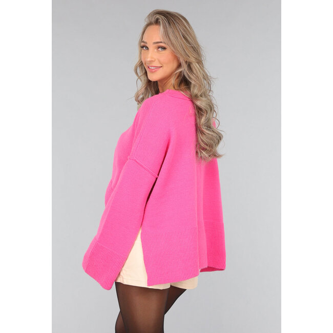 Rosa Strickpullover mit weiten Ärmeln