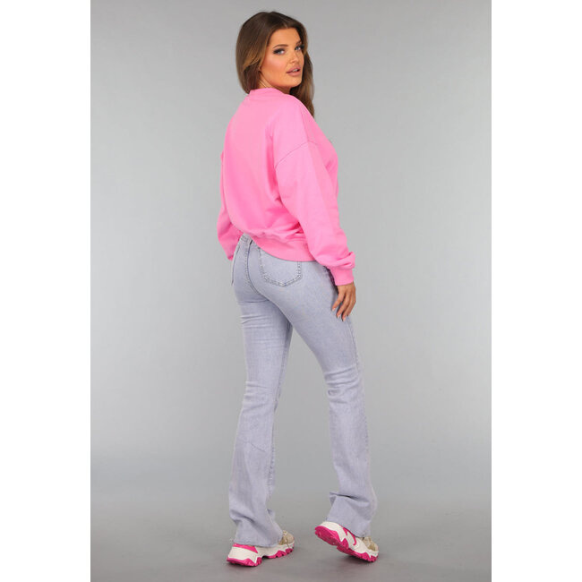 Rosa asymmetrischer Pullover