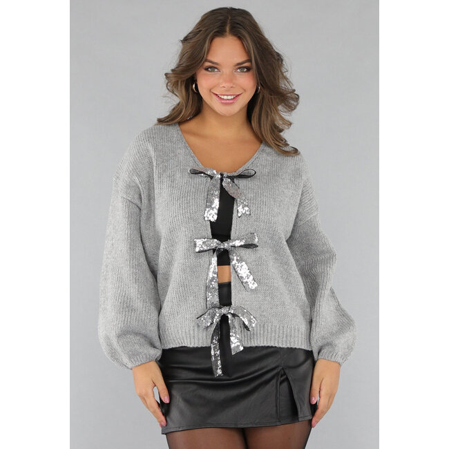 Grauer Pullover mit Pailletten-Schleifen