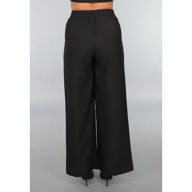 Schwarze Hose mit anthrazitfarbenem Schleifendetail