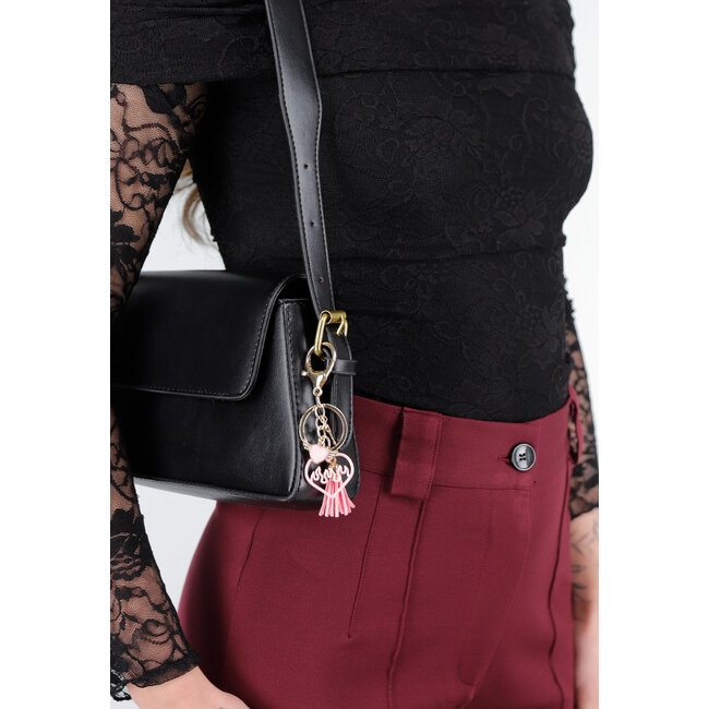 Schlüsselanhänger in Schwarz und Rosa mit Fransendetails