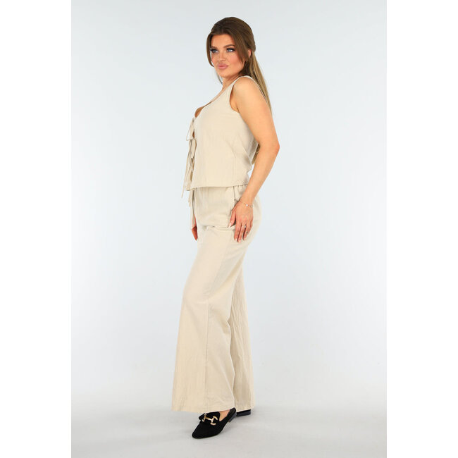 Beigefarbenes Set im Leinenlook mit Weste und weiter Hose mit Schleifenverschluss