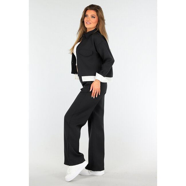 Zweiteiliges Set Schwarz mit Taillenband und Jacke mit Knopfverschluss