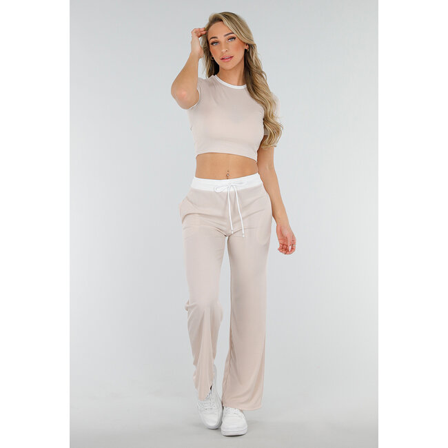 Beigefarbenes zweiteiliges Set mit langer Hose und kurzem Oberteil mit Colourblocking-Details