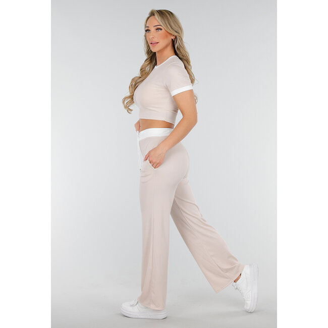 Beigefarbenes zweiteiliges Set mit langer Hose und kurzem Oberteil mit Colourblocking-Details