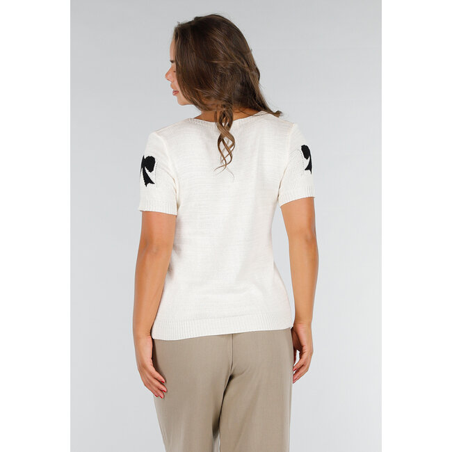 Cremefarbenes Strickoberteil mit schwarzem Schleifenaufdruck, Stretch und Bündchen an Ärmel und Unterteil