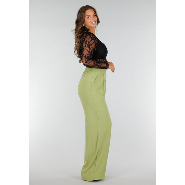 Schwarzes Spitzentop aus Stretch-Stoff mit langen Ärmeln und floralem Einsatz