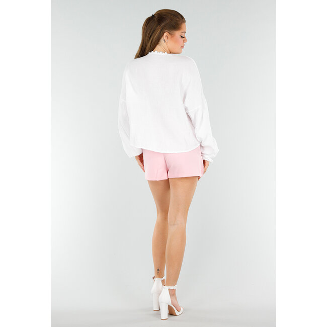 Weiße Bluse mit Kordelzugverschluss und Taschen in Herzform
