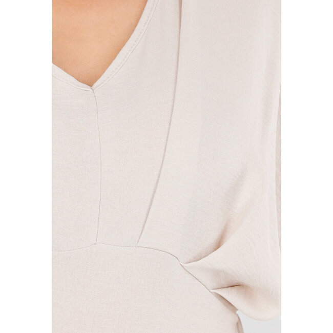 Beigefarbener Jumpsuit in Leinenoptik mit weiten Beinen und tiefem V-Ausschnitt