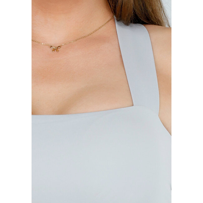 Graues Cropped Top mit gekreuzten Trägern und Fliege im Rücken