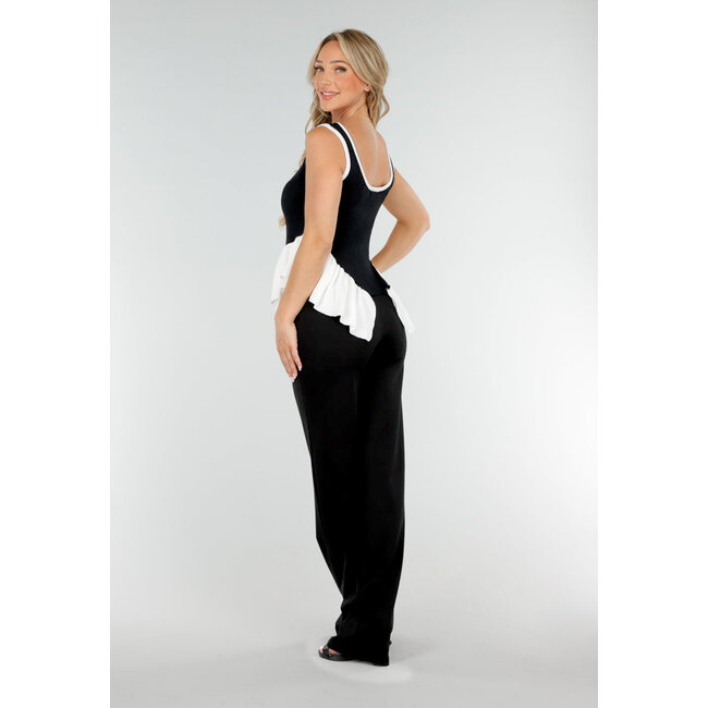 Schwarz-weißes Stretch-Top mit Rundhalsausschnitt und Rüschendetail am Saum
