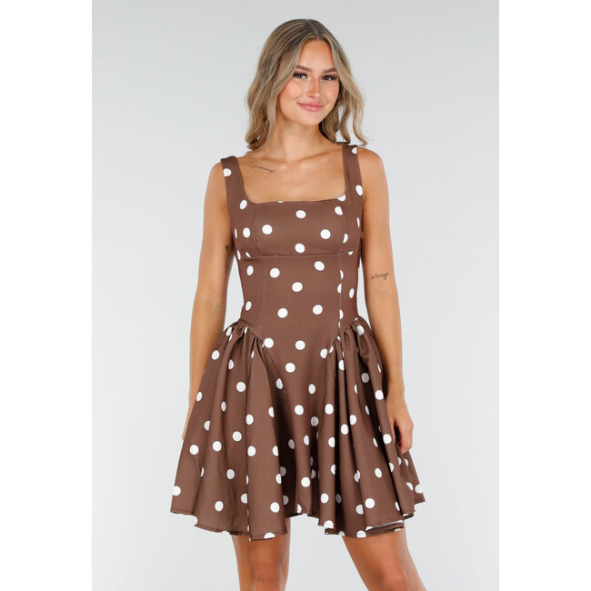 Braunes Retro-Kleid mit weißen Tupfen und Schleife