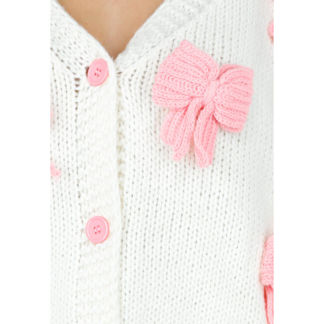 Gestrickte Strickjacke in Creme mit rosa Schleifen