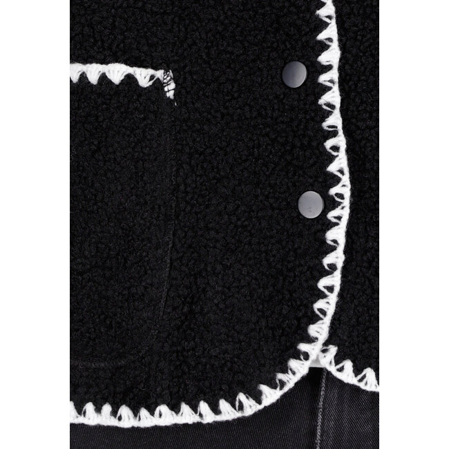 Schwarzes Teddy-Gilet mit weißen Rändern und Knopfverschluss