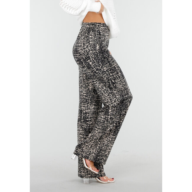 Schwarze weite Hose mit abstraktem Print