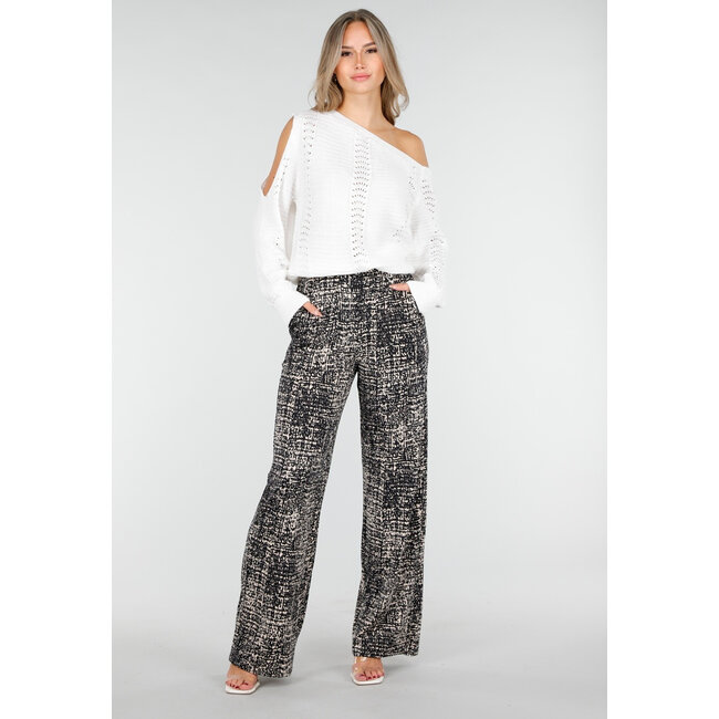 Schwarze weite Hose mit abstraktem Print