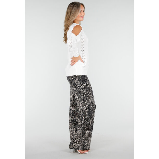 Schwarze weite Hose mit abstraktem Print