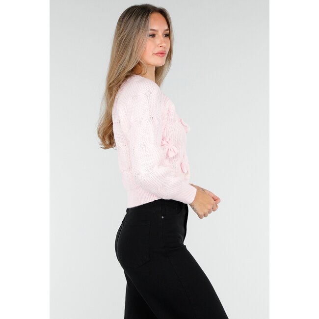 Rosa Strickjacke mit Schleifendetails und Knöpfen