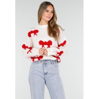 Weißer Pullover mit roten Schleifenmustern