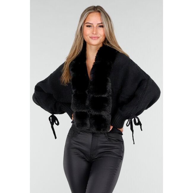 Schwarze Strickjacke mit Kunstfellkragen und Schleifendetails