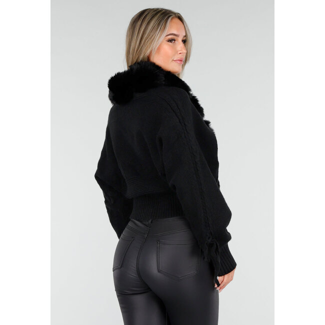 Schwarze Strickjacke mit Kunstfellkragen und Schleifendetails