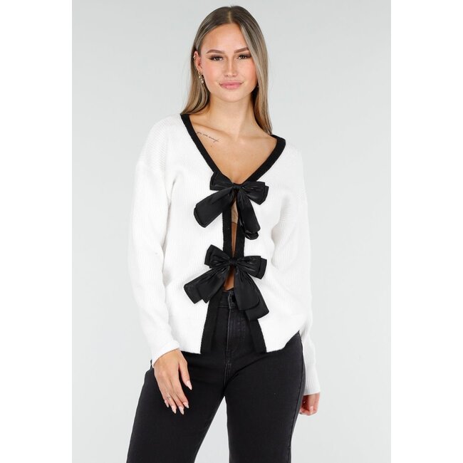 Weißer Cardigan mit schwarzen Schleifen und langen Ärmeln