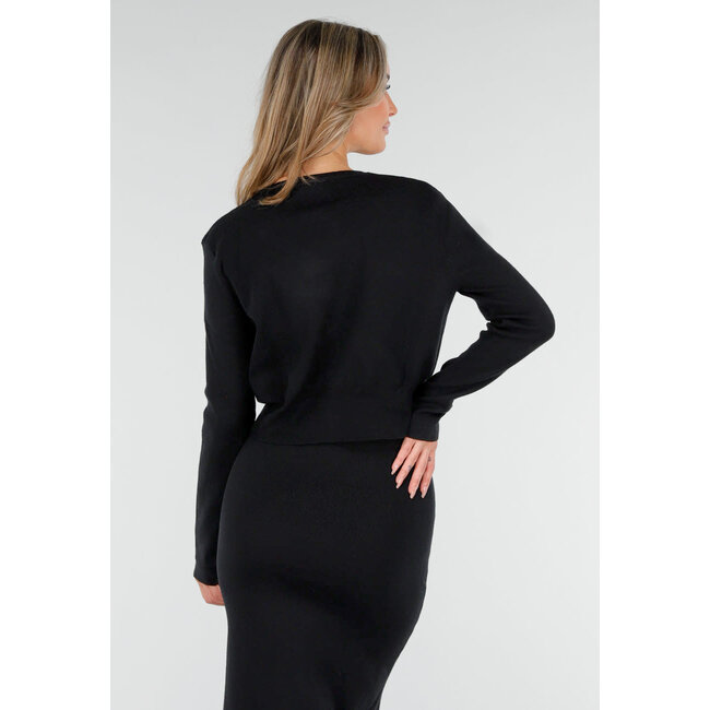 Schwarzes Strick-Set mit Midirock mit Schlitz