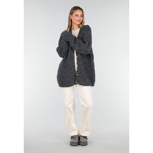 Grauer Sherpa-Mokassin mit dicker Sohle und Quasten