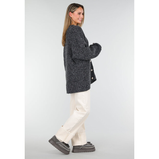 Grauer Sherpa-Mokassin mit dicker Sohle und Quasten