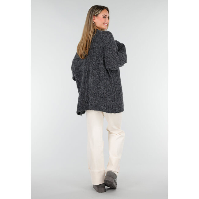 Grauer Sherpa-Mokassin mit dicker Sohle und Quasten