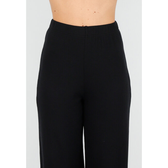 Asymmetrisches schwarzes zweiteiliges Set mit langen Ärmeln