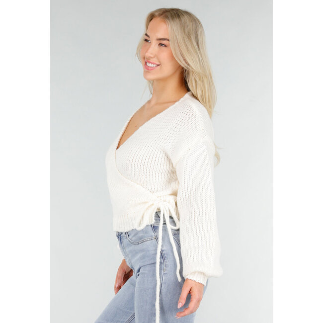 Cremefarbener Strickpullover mit V-Ausschnitt und gerippten Bündchen