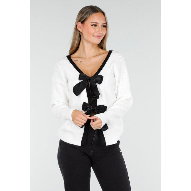 Weißer Cardigan mit schwarzen Schleifen und langen Ärmeln