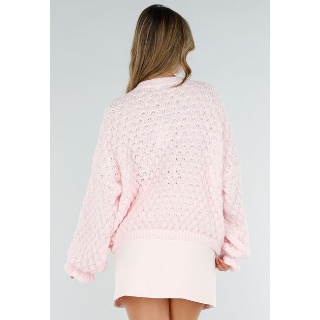 Hellrosa Strickpullover mit V-Ausschnitt