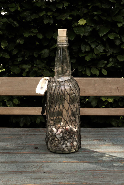 Bottle post bottle in net tied with a shell