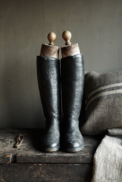 Antique row of boots with wooden mold