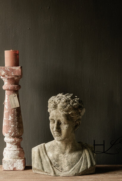 Weathered female bust