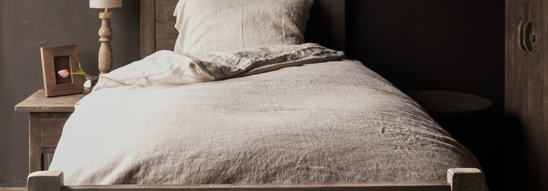 Sturdy single bed made of old used wood